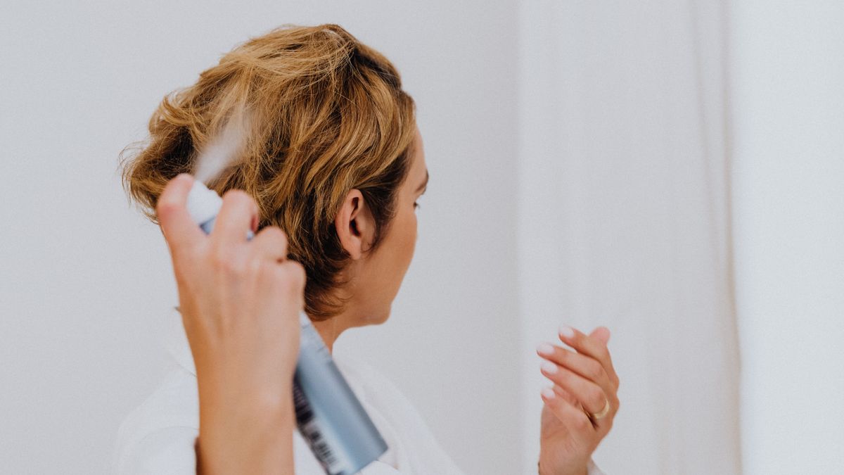 A spray bottle of homemade coconut oil hair detangler