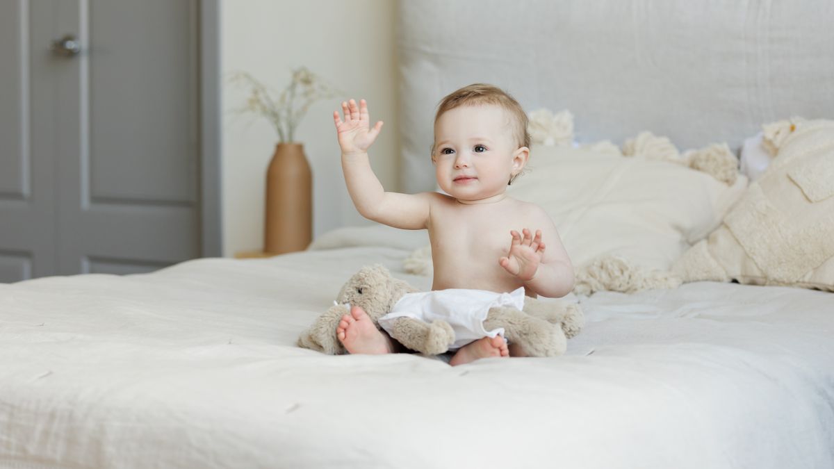 Parent gently caring for a baby, illustrating coconut oil for babies