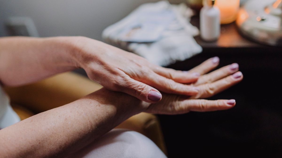 Moisturizing dry skin on hands, illustrating coconut oil for eczema