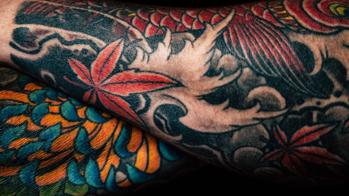 A tattooed arm, illustrating coconut oil for tattoos