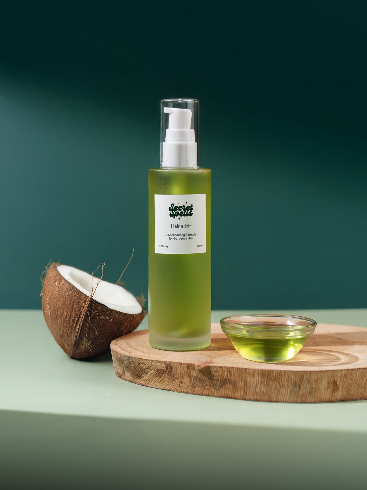 Bottle of coconut hair oil with fresh coconut