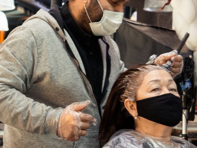 A deep conditioning coconut oil hair mask being applied