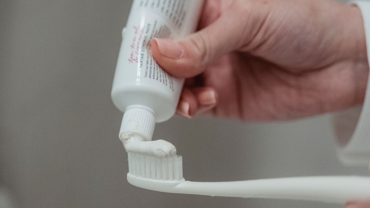 A toothbrush with natural homemade coconut oil toothpaste
