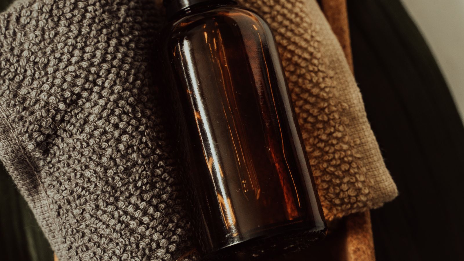 A dropper bottle of light carrier oil for skin and aromatherapy